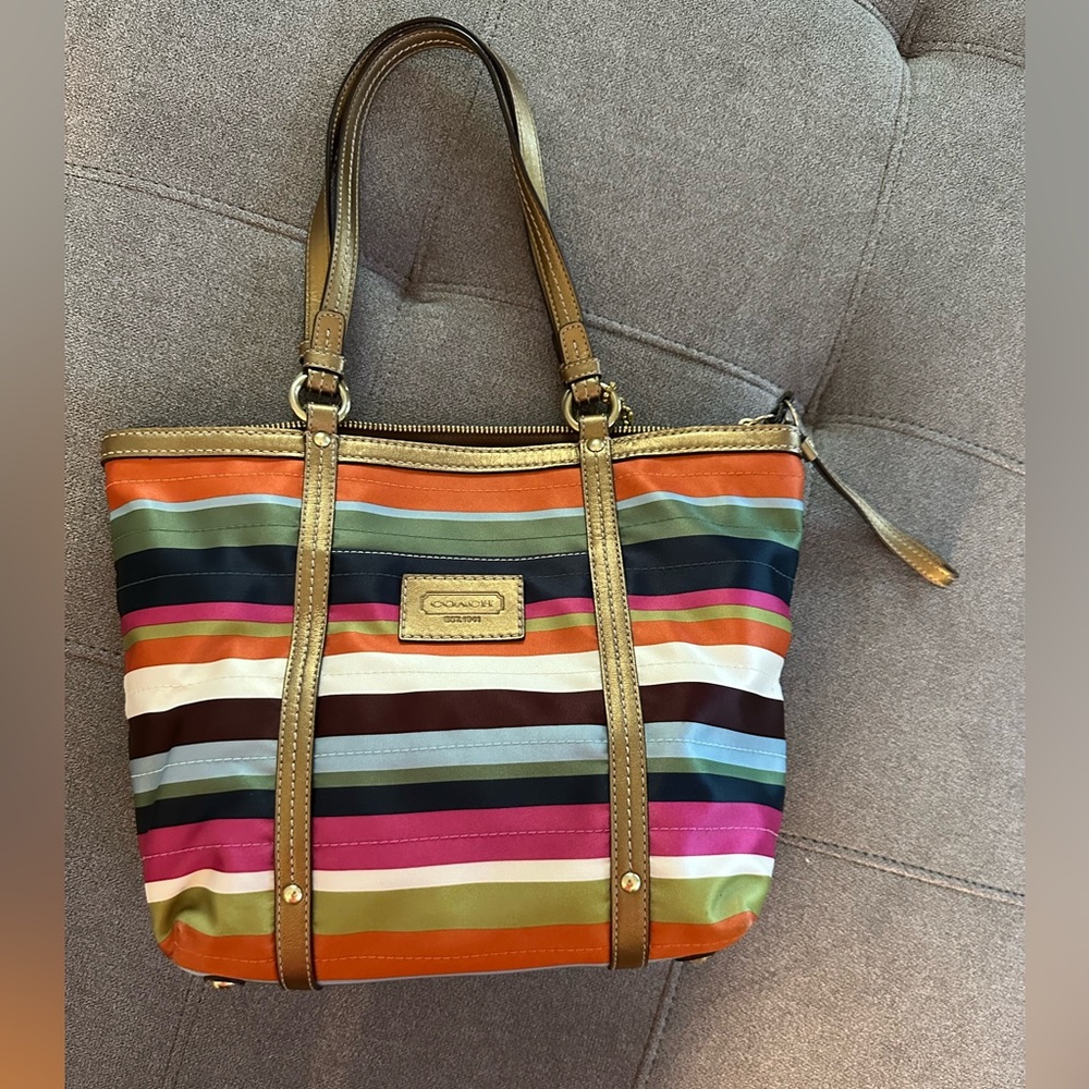 Excellent preowned condition. Coach striped tote.  From non-smoking home.